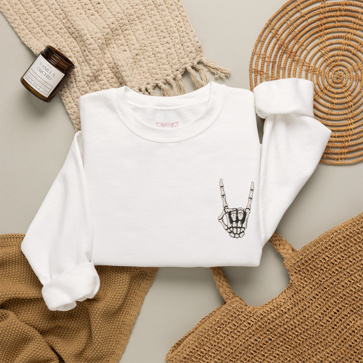 Bone Sign Skeleton Hand Sweatshirt in White — folded view