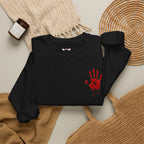 Red Handprint Sweatshirt in Black — folded view