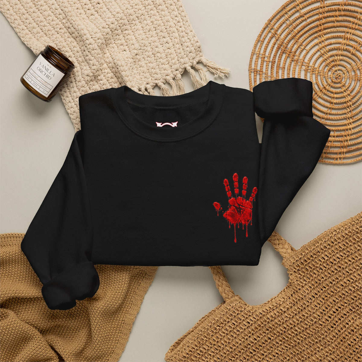 Red Handprint Sweatshirt in Black — folded view