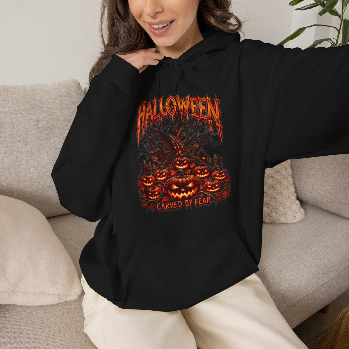 Carved by Fear Pumpkin Hoodie in Black — model view