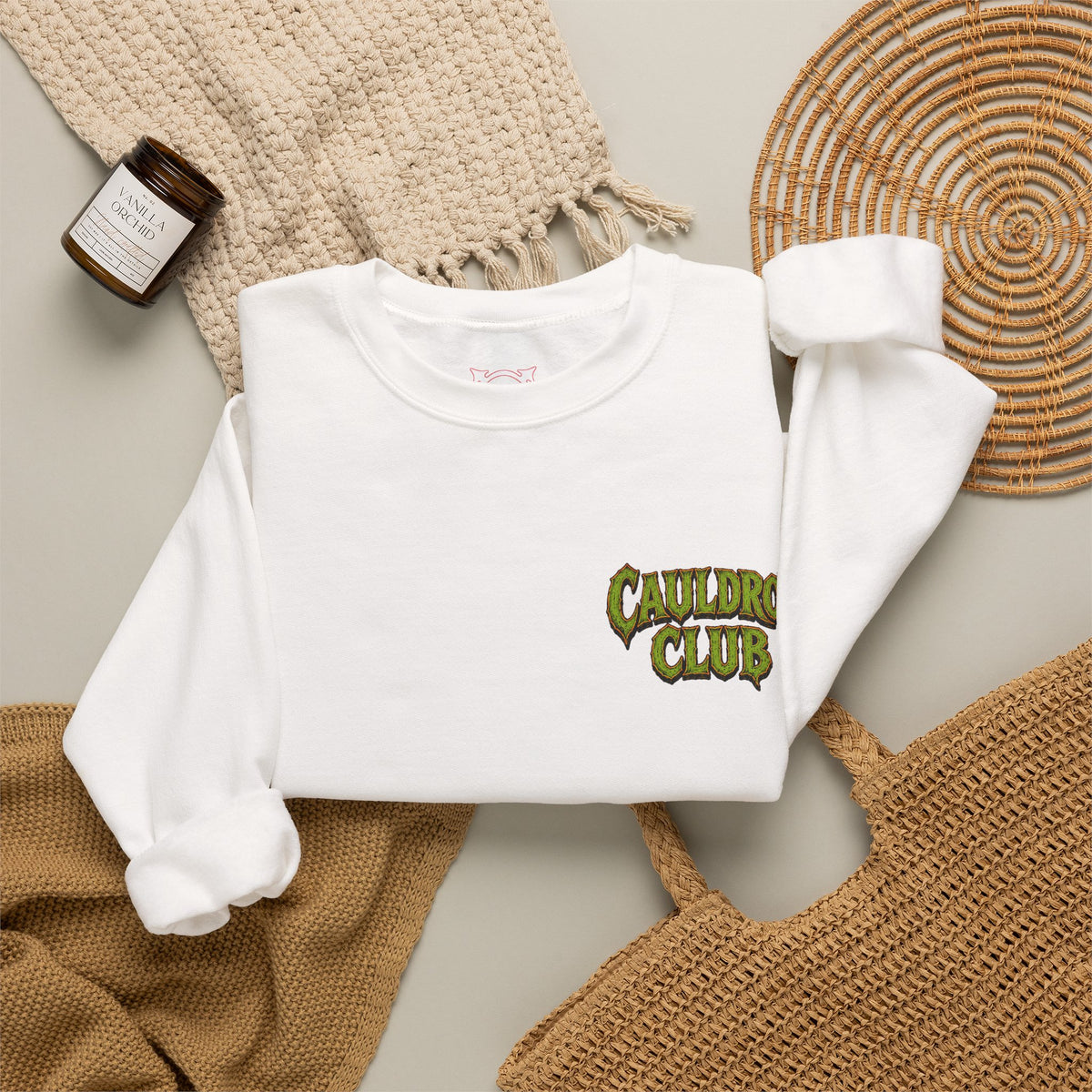 Cauldron Club Black Cat Sweatshirt in White — folded view
