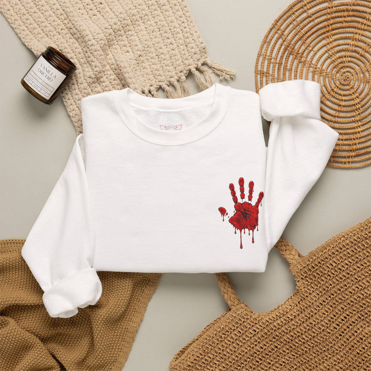 Red Handprint Sweatshirt in White — folded view