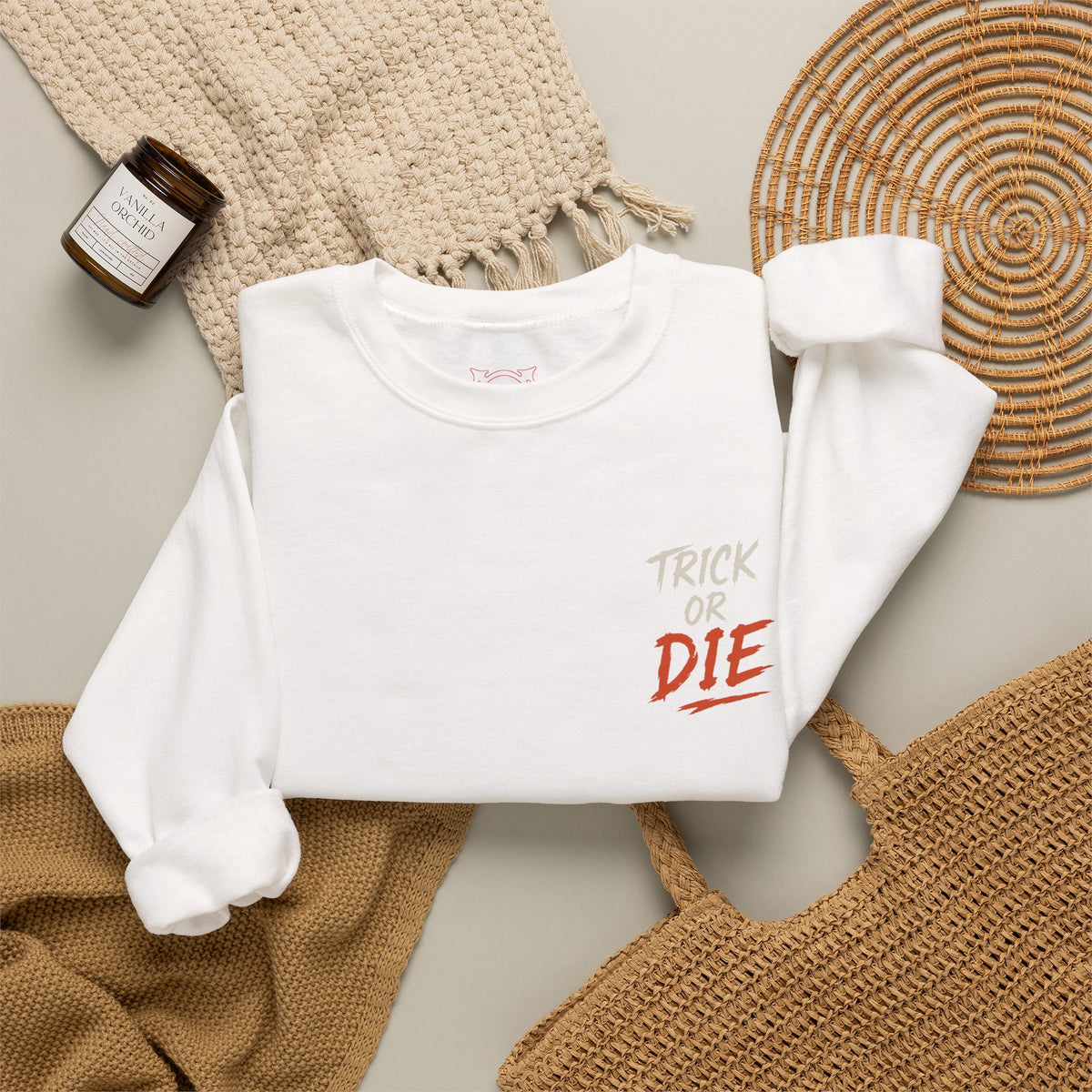 Trick or Die Halloween Sweatshirt in White — folded view