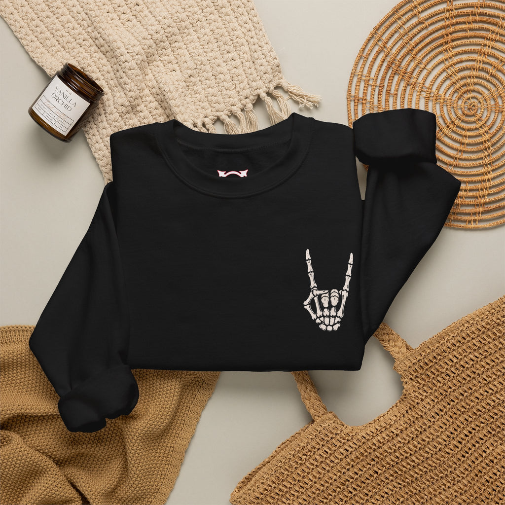 Bone Sign Skeleton Hand Sweatshirt in Black — folded view
