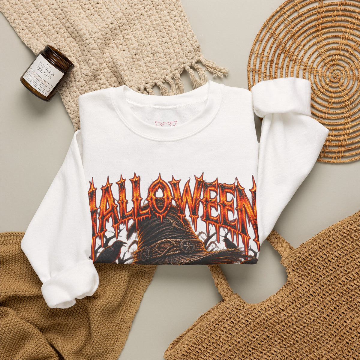 Trick or Treat Pumpkin Scarecrow Sweatshirt in White — folded view