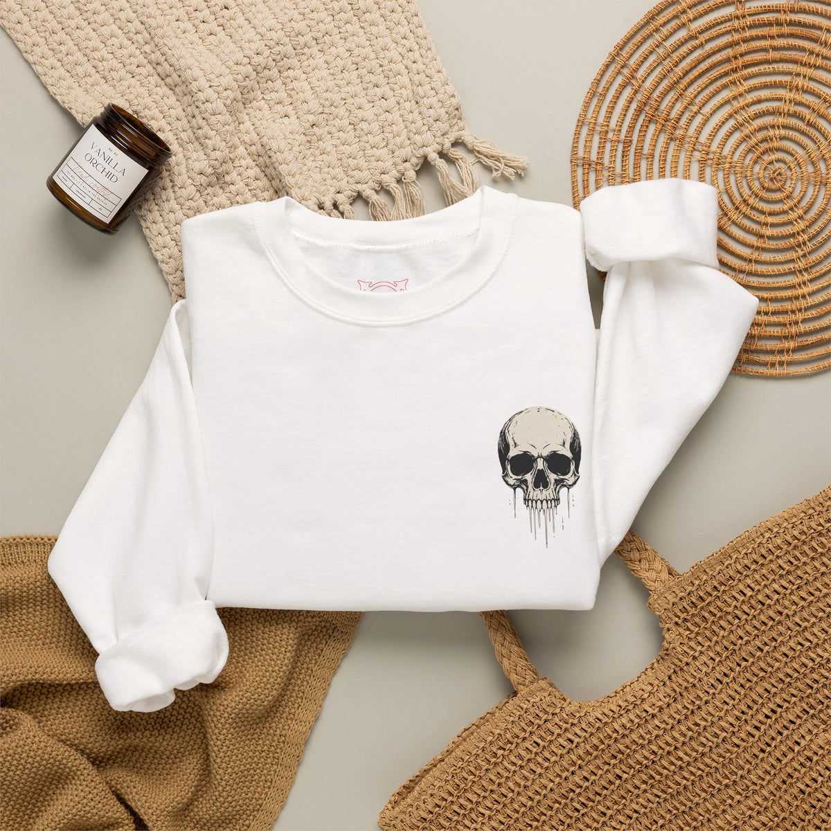 Dripping Skull Sweatshirt in White — folded view
